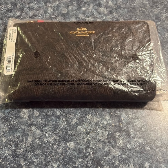 Coach large wristlet. NWT IM/ Brown/ watermelon.